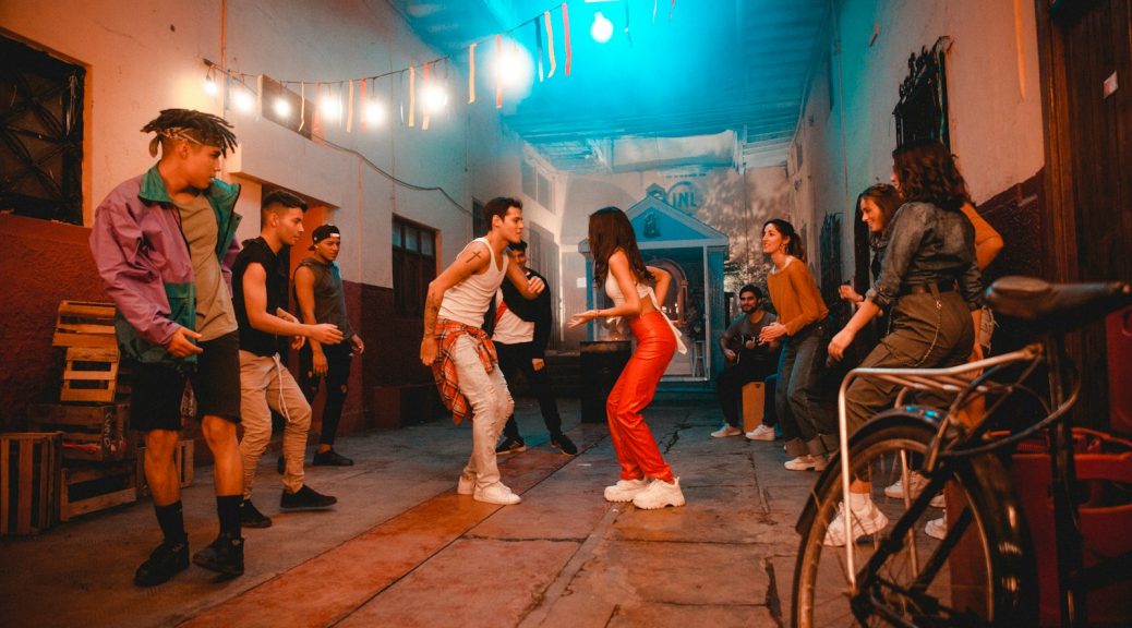 a group of people standing around in a room